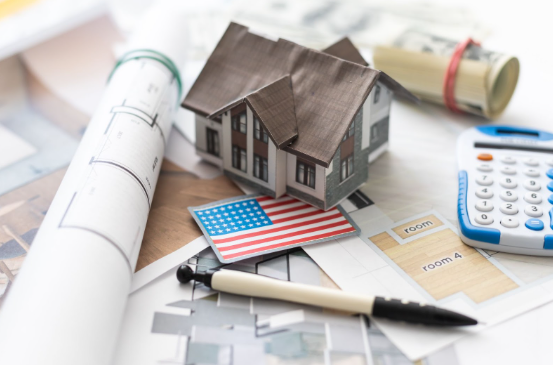 VA construction loan concept showing home blueprints, and U.S. flag